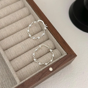 925 sterling silver twist hoop earrings with water wave texture in minimalist design