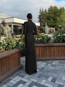 Elegant black high neck long sleeve maxi dress featuring flattering ruched back details