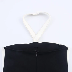 Detail of halter neck with pearl trim and back zipper on contrast midi dress