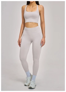 Detail of high-waist ribbed yoga set featuring U-neck top and seamless compression leggings