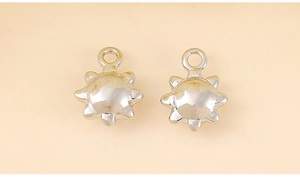 Detailed view of silver sun charms for DIY jewelry making with top rings for pendants