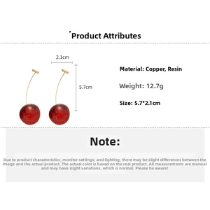 Detail view of red resin cherry earrings with dimensions 5.7cm and weight 12.7g specs