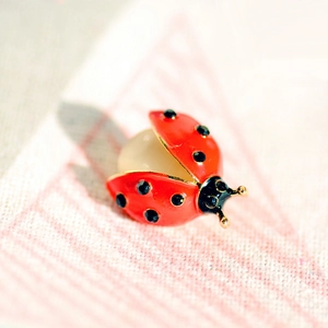 Cute ladybug insect brooch with red enamel wings, black rhinestones and a white pearl