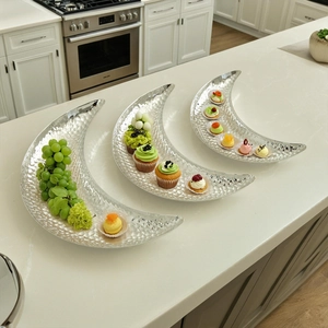 Three-piece silver crescent moon metal trays with hammered texture for fruit and desserts