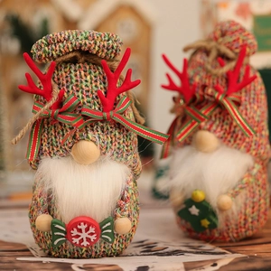 Close-up of a festive Christmas gnome featuring a knitted hat and a cute wooden nose