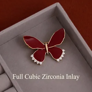 Elegant red enamel butterfly brooch with gold plating and sparkling zircon stones