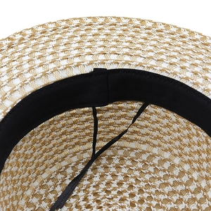 Adjustable interior of woven straw sun hat with black sweatband and sizing string