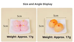 Miniature food keychains with cherry blossom and rice cake designs on 5cm square trays