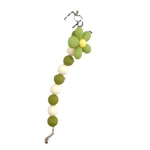 Green and white floral acrylic beaded phone strap accessory with a metal lobster clasp