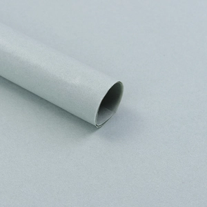 Close-up of grey tissue wrapping paper roll for floral bouquets and gift packaging