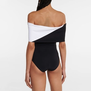 Rear view of minimalist black and white one-piece swimsuit with off-the-shoulder wrap design