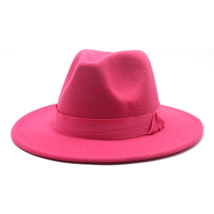 Detail of rose red wool felt fedora with a matching satin ribbon and wide flat brim