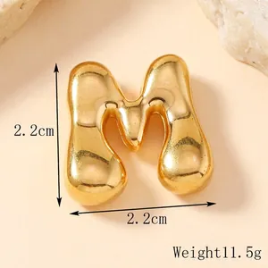 Golden 3D letter M pendant with smooth mirror finish and polished liquid design style