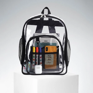 Detailed view of a transparent PVC backpack showing large storage capacity and mesh side pocket