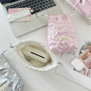 Chic quilted heart drawstring storage bags in pink, silver, and cream for digital items