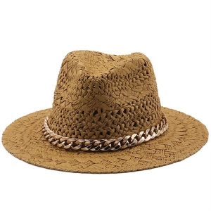 French vintage straw hat with a gold chain trim for sun protection and beach travel
