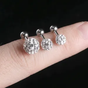 Three-piece set of sparkling cubic zirconia ball studs in varying sizes on stainless steel