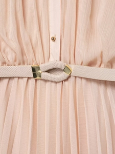 Close-up of pink pleated chiffon dress with a matching waist belt and gold buckle