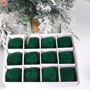 Set of 12 green velvet Christmas balls with embossed textures in a white storage box