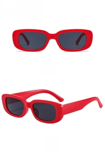 Detail view of red rectangular sunglasses with dark lenses from two different angles