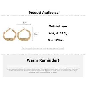 Detail view of 3cm brushed gold hoop earrings with silver pins and weight specifications