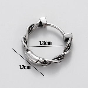 Macro shot of silver textured earring showing dimensions 1.3cm inner and 1.7cm height