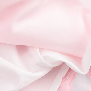 Pink sweet jacquard dress with square neck and long sleeves, showing fabric texture details