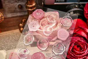 Detail of 3D embossed rose stickers with gold foil accents on vintage rose background