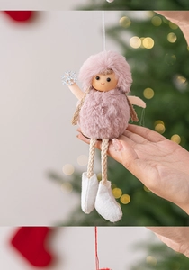 Detailed view of plush Christmas angel doll ornament with pink dress and silver snowflake