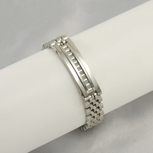 Polished silver stainless steel watch-link bracelet for men on a display stand