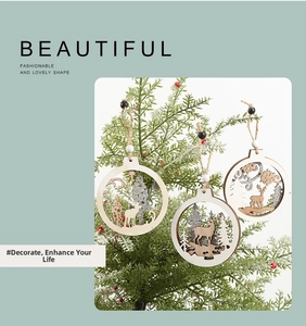 Detail of wooden Christmas tree ornaments with reindeer cutouts and silver glitter finish