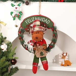 Christmas wreath with plush reindeer and Feliz Navidad banner on natural rattan loop