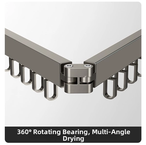 Close-up of gray metal folding drying rack showing 360-degree rotating bearing structure