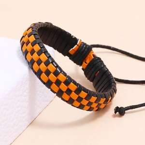 Braided black and orange checkered leather bracelet with adjustable cord on stone