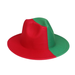 Detail shot of a two-tone red and green wool fedora with a wide brim and jazz style