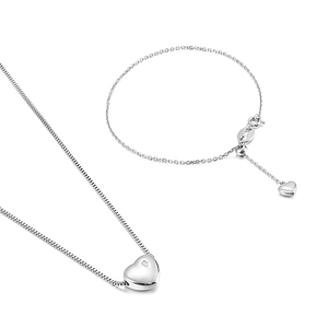 Silver stainless steel jewelry set featuring heart pendants with necklace and bracelet