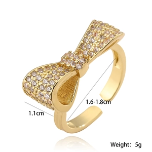 Adjustable 18K gold plated bow ring with sparkling cubic zirconia in minimalist style