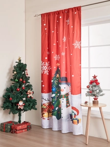 Christmas snowman curtain detail with reindeer patterns in festive red home setting