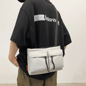 White nylon crossbody messenger bag with dual utility pockets and black strap for men