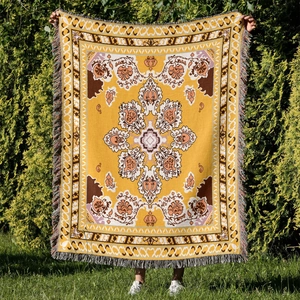 Detailed knit texture of bohemian yellow mandala outdoor camping blanket with tassels