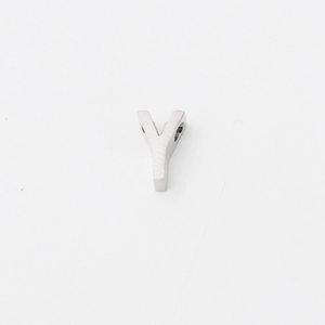 Detailed macro view of a silver titanium steel Y-letter charm with polished finish