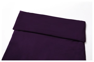 Detail view of high-waist yoga leggings with wide fold-over band and reinforced seams