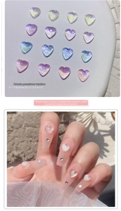 Macro detail of aurora heart nail charms showing iridescent shifts and 3D application