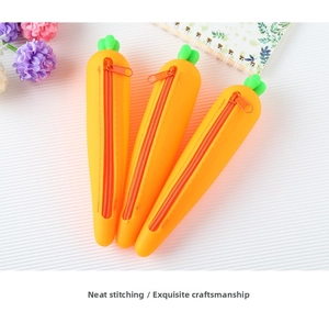 Close-up of three creative carrot-shaped silicone pencil cases with durable orange zippers