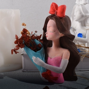 European girl flower pot silicone mold showing 3D creative resin statue with red bowknot