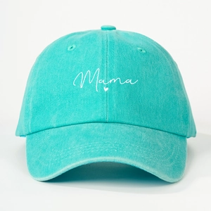 Close-up of Mama script embroidery and heart detail on mint green washed cotton cap