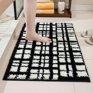 Absorbent black and white checkered bathroom rug with soft non-slip plush texture