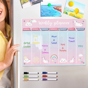 Acrylic magnetic weekly planner on fridge with unicorn design and colorful markers