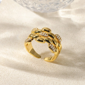 Macro shot of gold adjustable chain ring with micro-pave white cubic zirconia detail