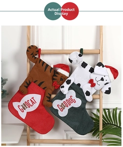 Detail of Christmas pet stockings with cat and dog 3D heads hanging on a wooden ladder